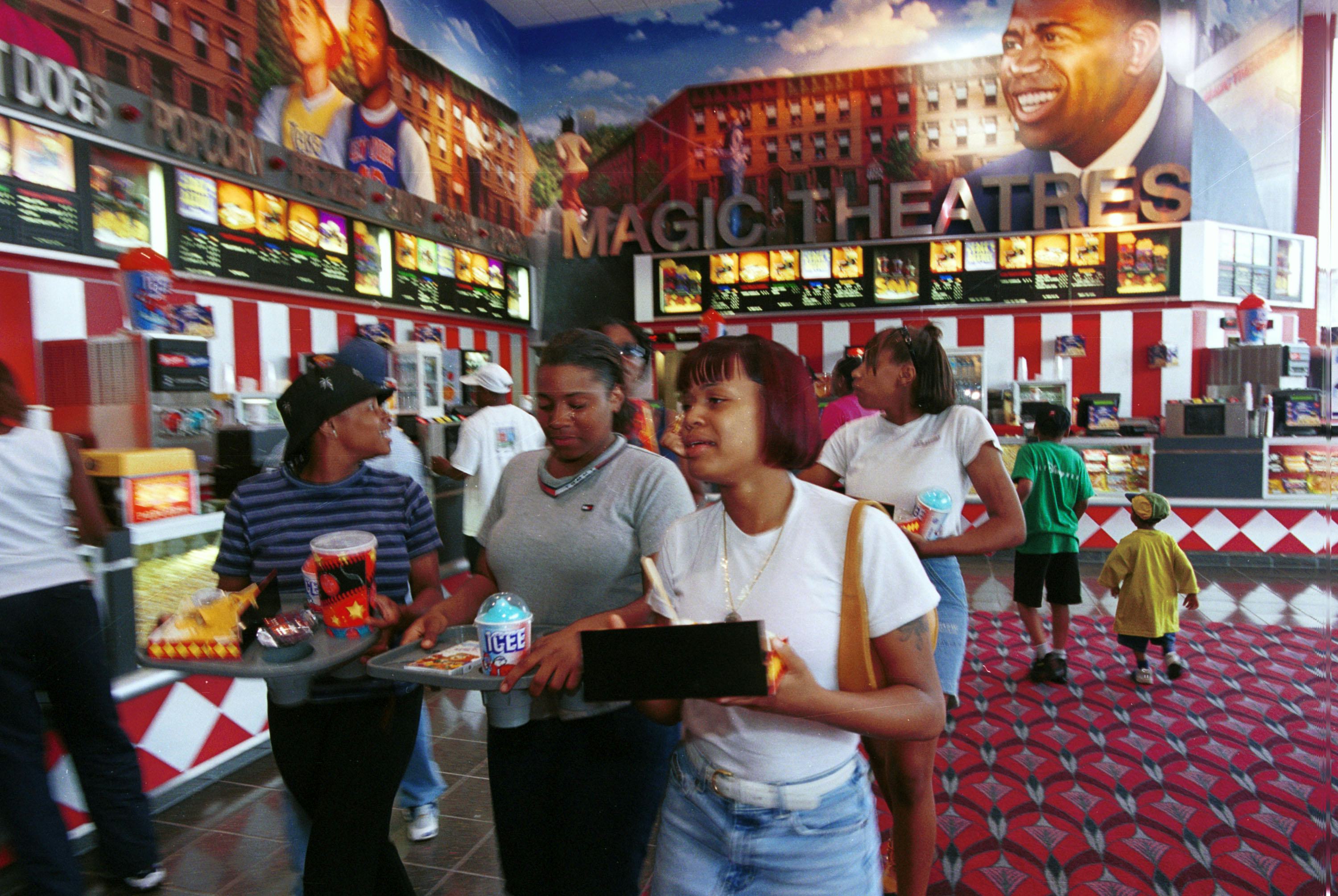 372768 02: Visitors buy food from the concession at Magic Johnson Theatres inside the new Harlem USA&hellip;