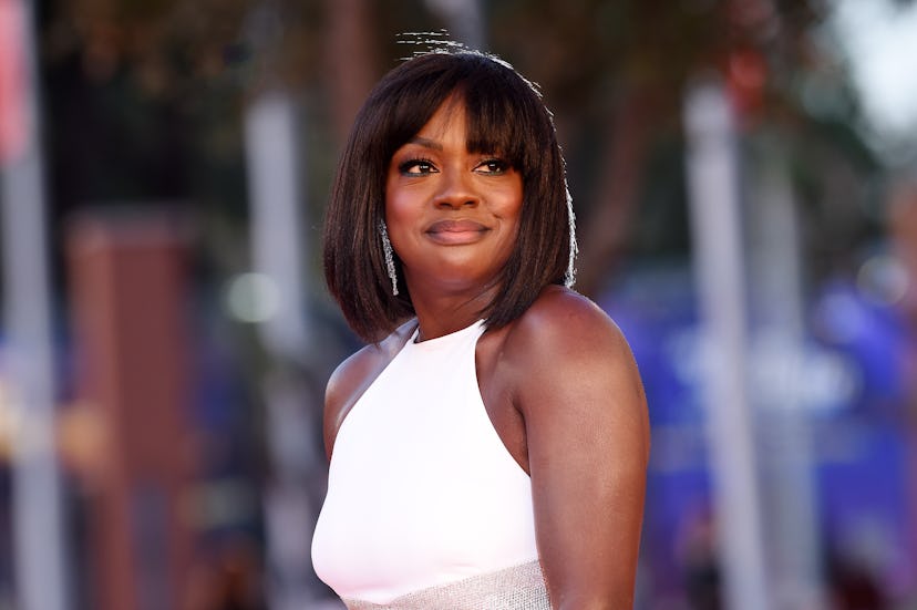 Viola Davis wears a white dress from Michael Kors Collection.