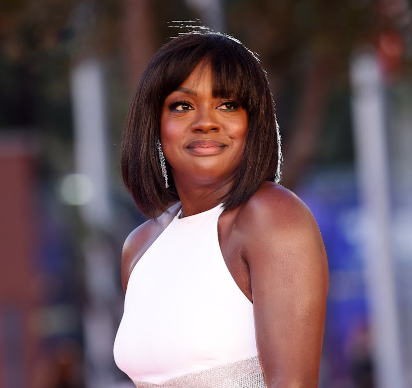 Viola Davis wears a white dress from Michael Kors Collection.