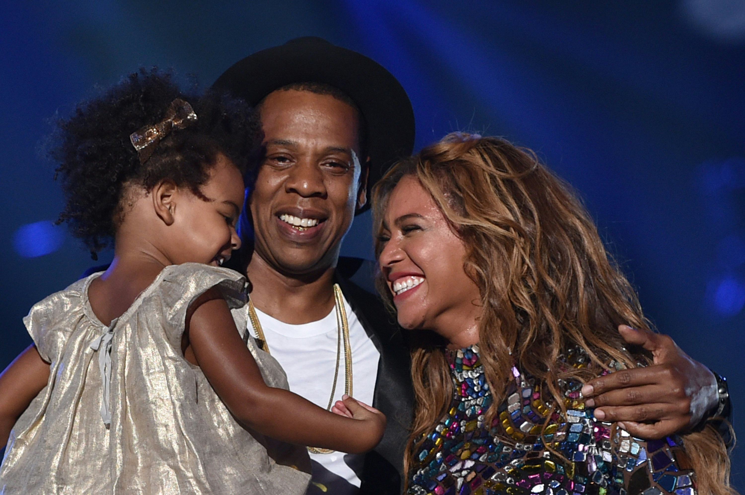 Baby Blue Ivy Carter, Jay Z and Beyonce in 2014.