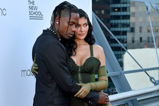 Kylie Jenner posts new photo of Travis Scott holding their baby boy.