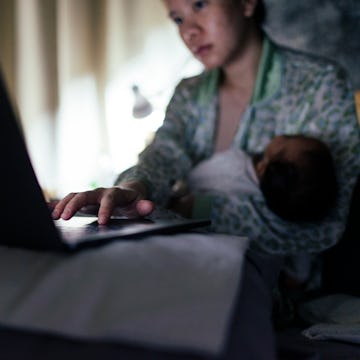 A mom works while caring for an infant -- a new study has found that moms who get three months of pa...