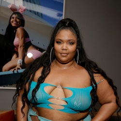 Lizzo  wears cut-out crop top and matching blue skirt