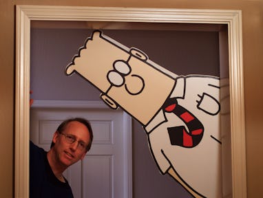 DILBERT/C/17DEC98/DD/MAC Scott Adams, the creator of "DILBERT" the comic strip has a ...