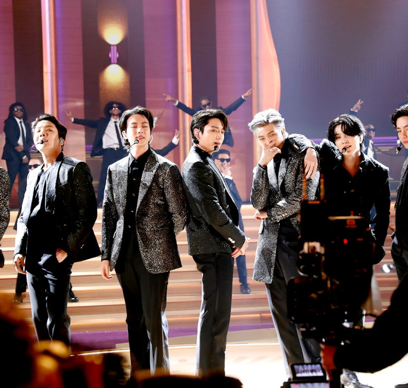 Jimin, J-Hope, Jin, Jungkook, RM, Suga, and V of BTS perform onstage and just announced a new BTS al...