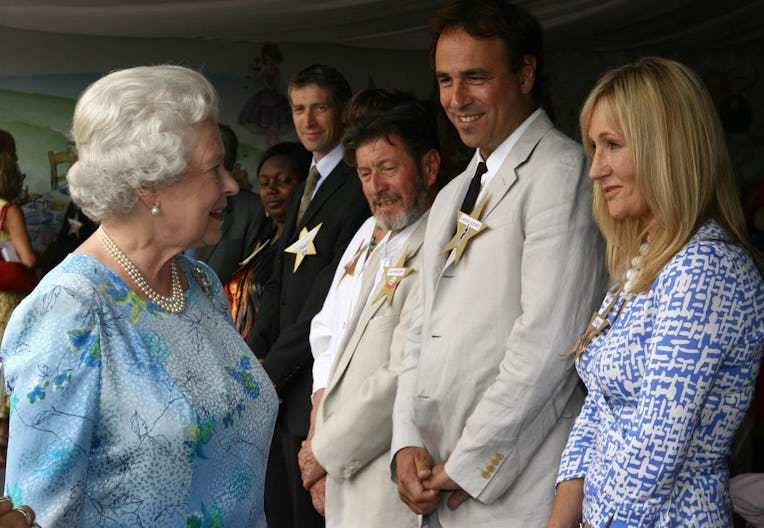 Britain's Queen Elizabeth II meets author J.K Rowling during the Children's Garden Party at Buckingh...