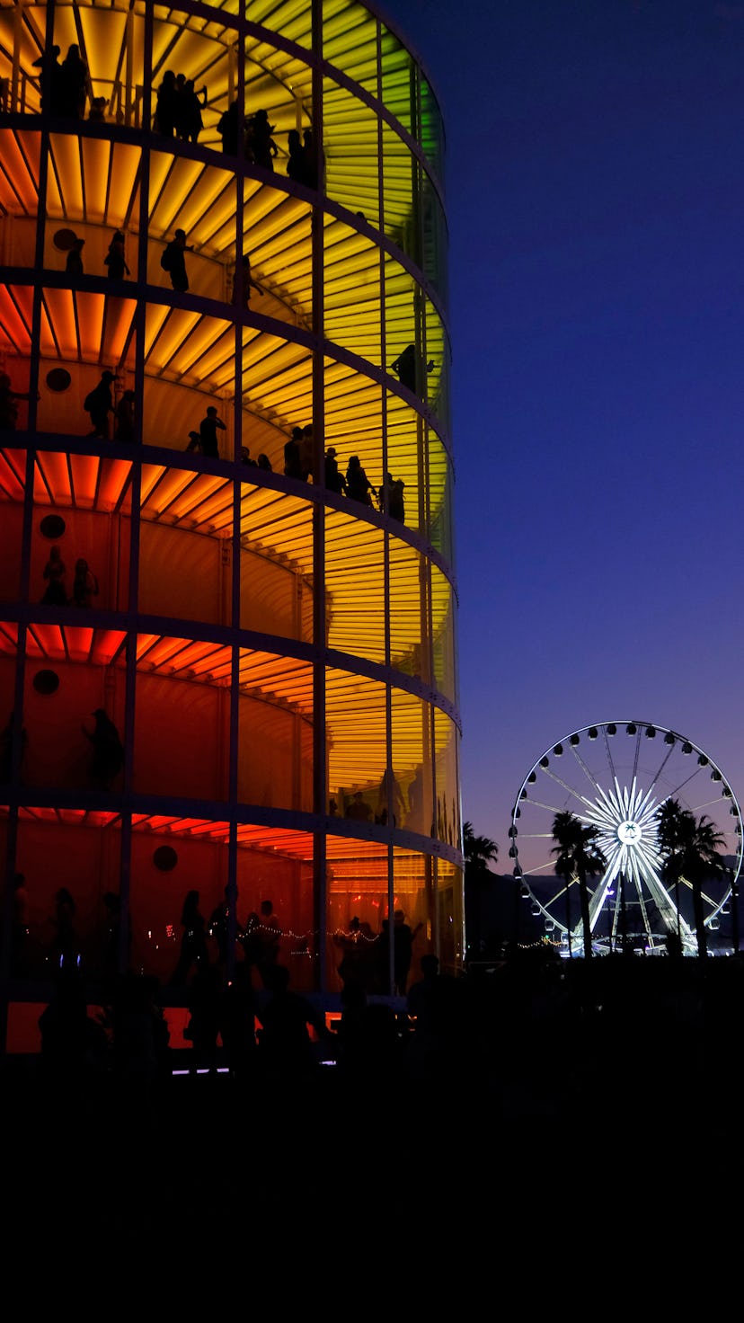 INDIO, CA - APRIL 20:  Art installation Spectra by NEWSUBSTANCE and the ferris wheel are seen during...