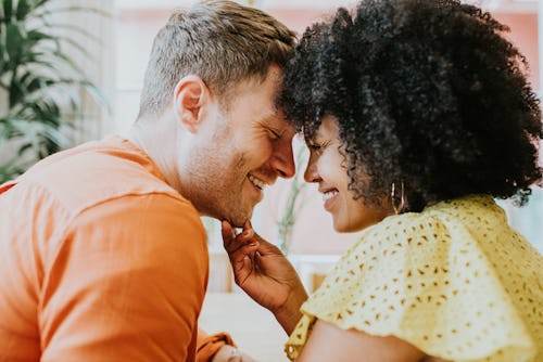 Close-up of a young couple pressing their foreheads together. Life Path Number 2 Compatibility In N...
