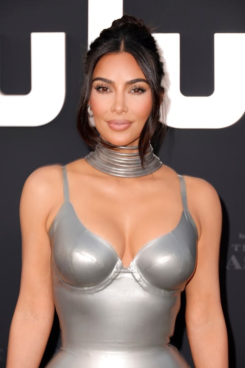 Kim Kardashian attends the premiere of Hulu show "The Kardashians" in silver latex bustier dress