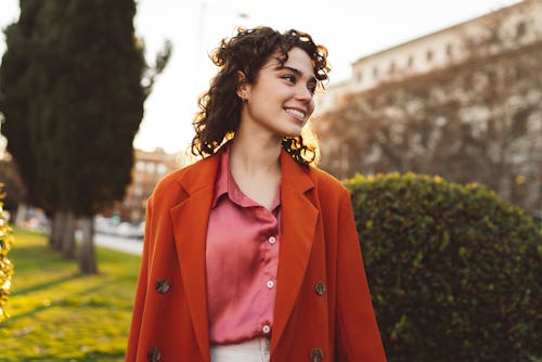 A woman walks through a neighborhood. Here's how Mercury retrograde spring 2022 will affect your zod...