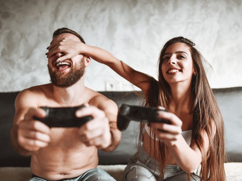 Jealous Female Closing Boyfriends Eyes To Beat Him At Video Game