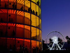 INDIO, CA - APRIL 20:  Art installation Spectra by NEWSUBSTANCE and the ferris wheel are seen during...