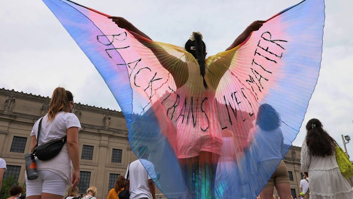 NEW YORK, NEW YORK - JUNE 13: A person spreads wings with the words "Black Trans Lives Matter" writt...