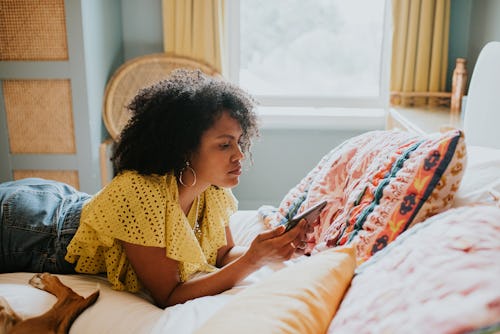Woman scrolls through Instagram feed in her bed and turns off Reels suggestions. How to turn off Ree...