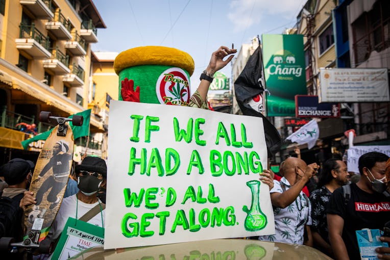 BANGKOK, THAILAND - APRIL 20: A sign that reads "if we all had a bong we'd all get along" is seen on...