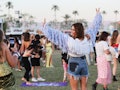 A woman at the Coachella festival thinks of Coachella quotes and slogans for her Instagram post.