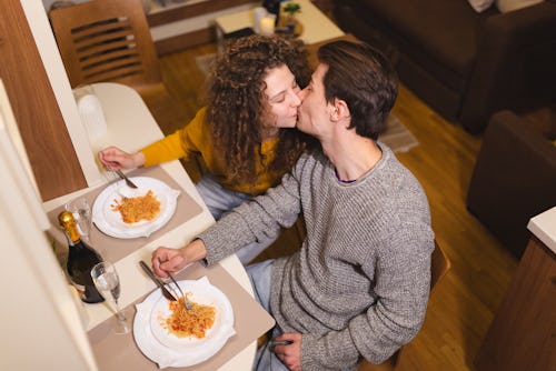 A couple made a romantic dinner at home. Relationship Soft Launch Instagram Caption Ideas