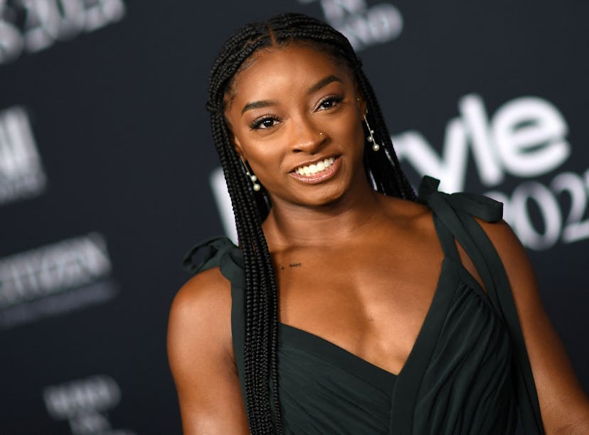 Simone Biles at the InStyle Awards before her floral, orange manicure.