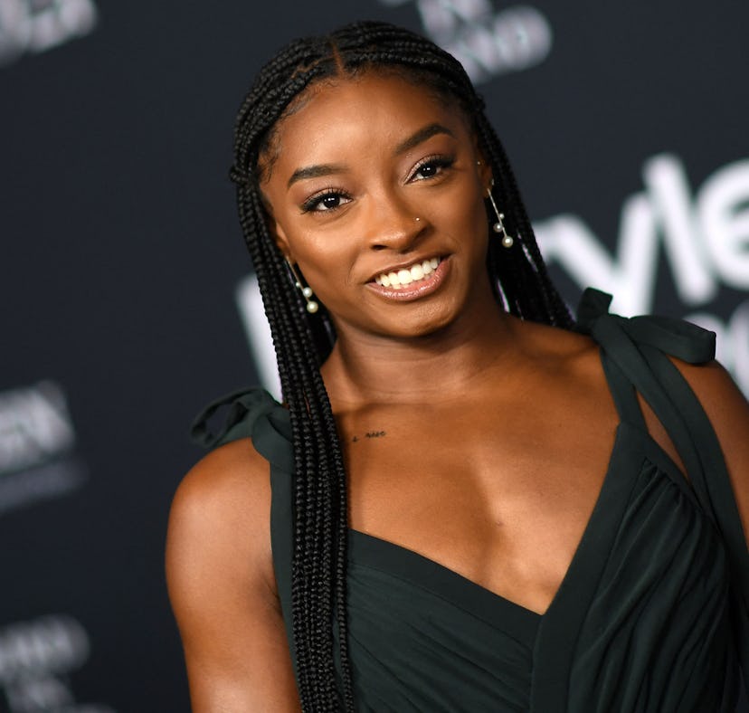 Simone Biles at the InStyle Awards before her floral, orange manicure.