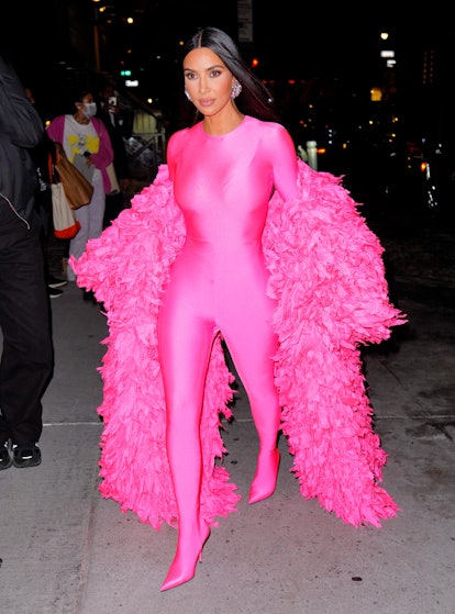 Kim Kardashian arrives at the afterparty for "Saturday Night Live" in hot pink bodysuit and fur coat