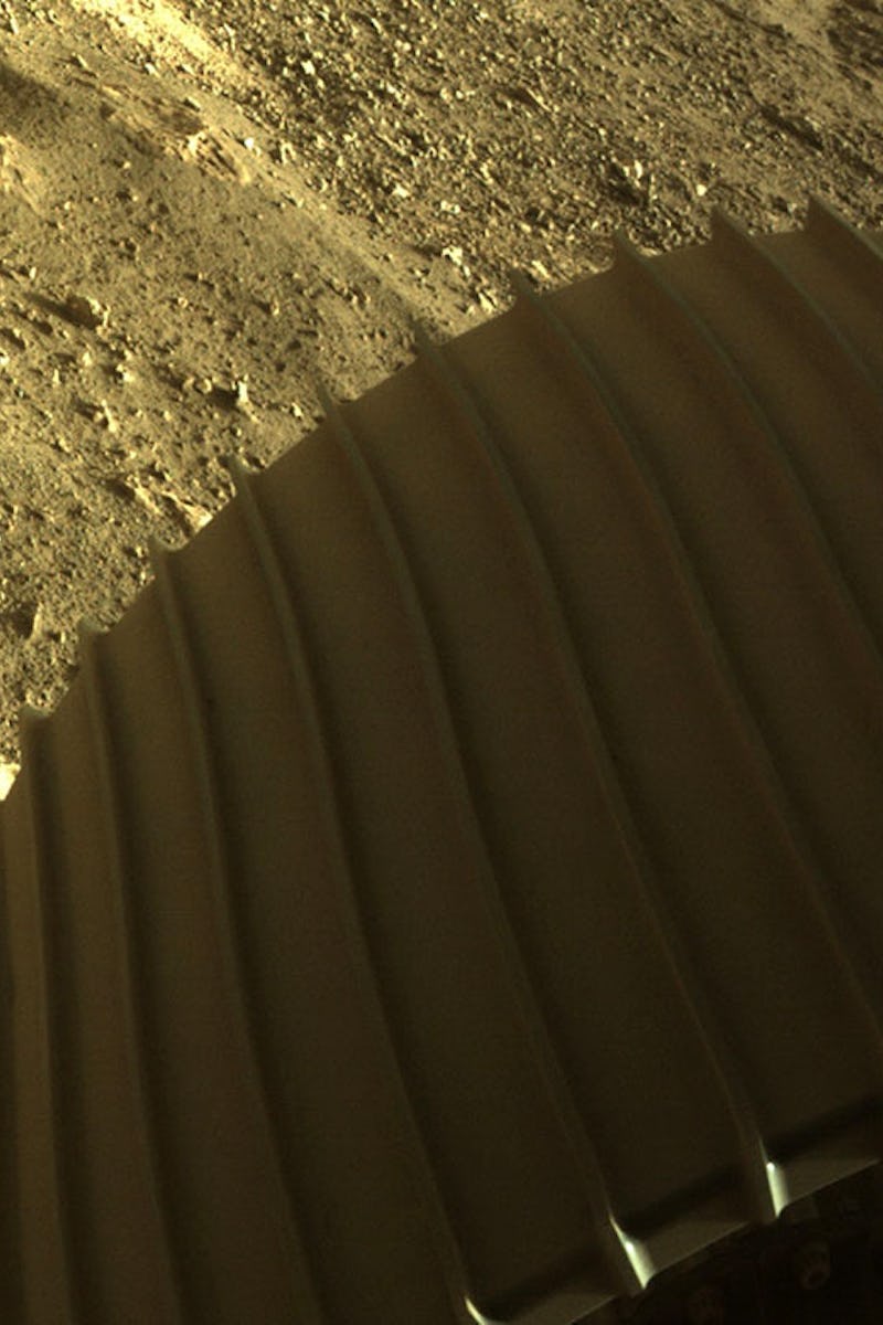 JEZERO CRATER, MARS - FEBRUARY 18: In this handout image provided by NASA, one of the six wheels a...