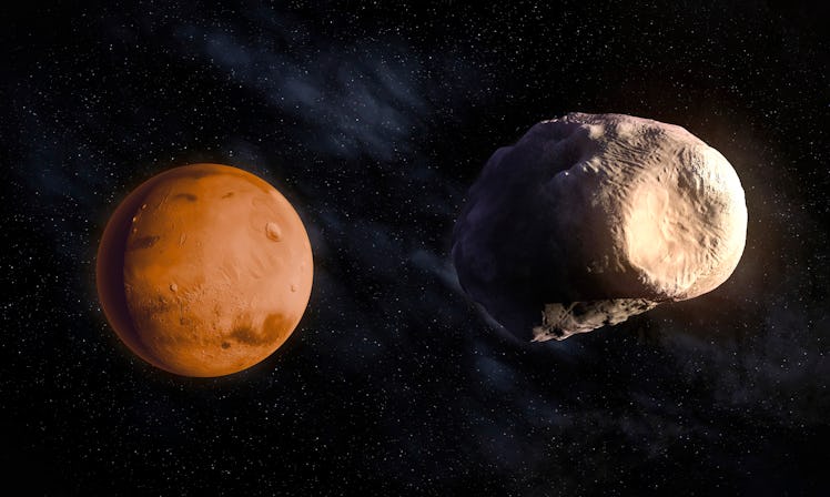 Phobos and Mars, computer artwork.
