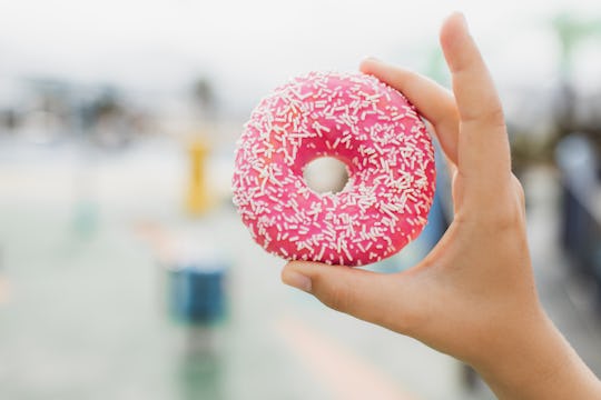 Favorite american fast food. Traditional sweet snack. Positive emotions and pleasure when eating fas...