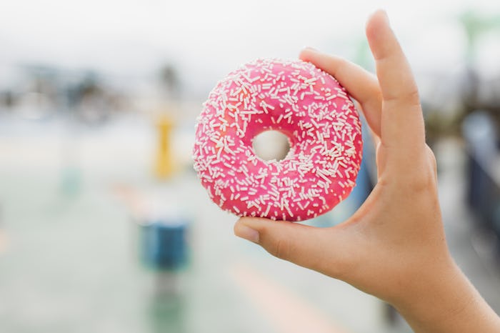 Favorite american fast food. Traditional sweet snack. Positive emotions and pleasure when eating fas...
