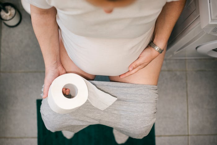 postpartum mom on toilet, pooping after a C-section