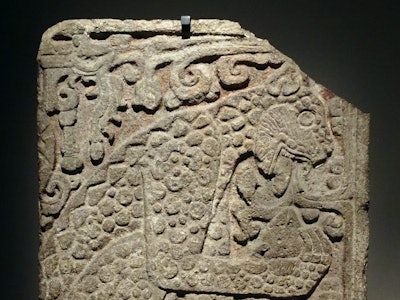 Mayan, calcified stone panel, with bas relief depicting a jaguar eating a heart. From the Great Pala...