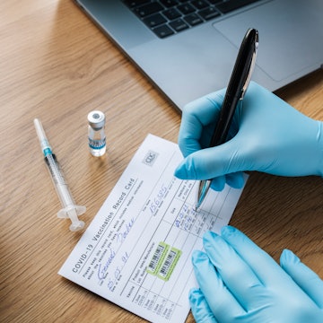 A Covid 19 vaccine card - teachers in New York have been put on unpaid leave for allegedly submittin...