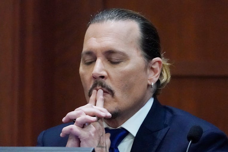 Actor Johnny Depp testifies in the courtroom at the Fairfax County Circuit Courthouse in Fairfax, Vi...