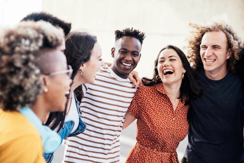 A friend group laughs. These are the friendliest zodiac signs.