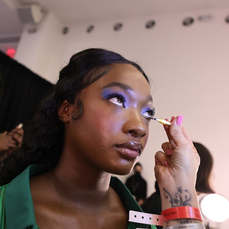A model wearing pastel makeup  prepares backstage at the Kim Shui show during New York Fashion Week:...