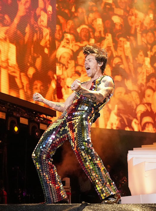 Harry Styles performs onstage at Coachella 2022 in Gucci paillette jumpsuit