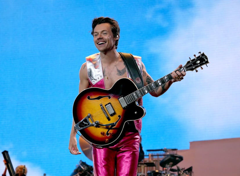 Harry Styles performs onstage at Coachella 2022 in metallic cowboy-inspired look from Gucci