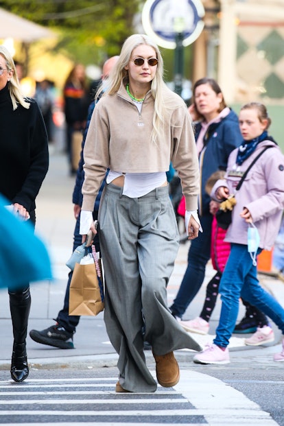 Gigi Hadid wearing chestnut uggs with low-rise pants 