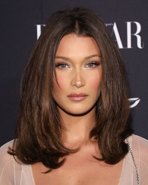 The fluffy, 90s blowout — seen here on Bella Hadid's hair — is a top trending hairstyle in 2022.