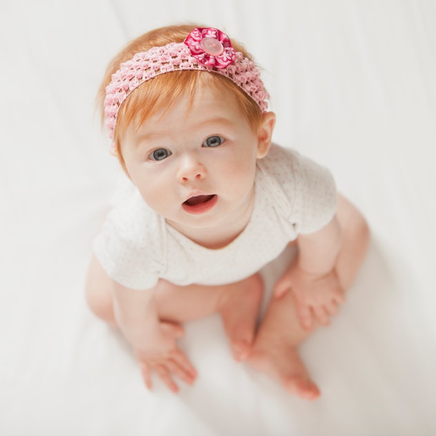 Red haired baby girl in headband, short middle names for girls