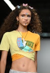 A model walks the runway with a Y2K beauty look at the Conner Ives show during London Fashion Week F...