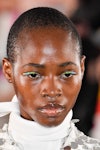 A model wearing duochrome eyeliner walks the runway during the Giambattista Valli Ready to Wear Fall...
