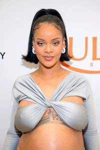Rihanna, pregnant, in a metallic wrap top at the launch of Fenty Beauty at ULTA Beauty on March 12, ...