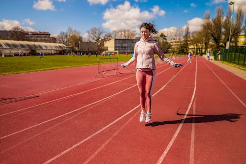 Female athlete exercising outdoors with a jumping rope. Here's how the April new moon solar eclipse ...