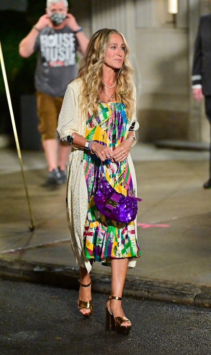 Sarah Jessica Parker aka Carrie Bradshaw carries a purple sequin Fendi Baguette bag.