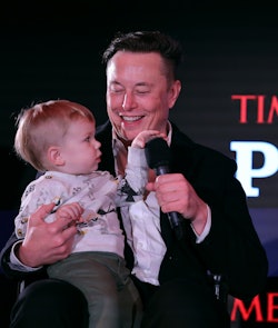 NEW YORK, NEW YORK - DECEMBER 13: Elon Musk and son X Æ A-12 on stage TIME Person of the Year on Dec...