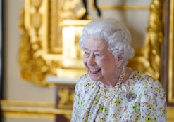 WINDSOR, ENGLAND - MARCH 23: Queen Elizabeth II smiles as she arrives to view a display of artefacts...