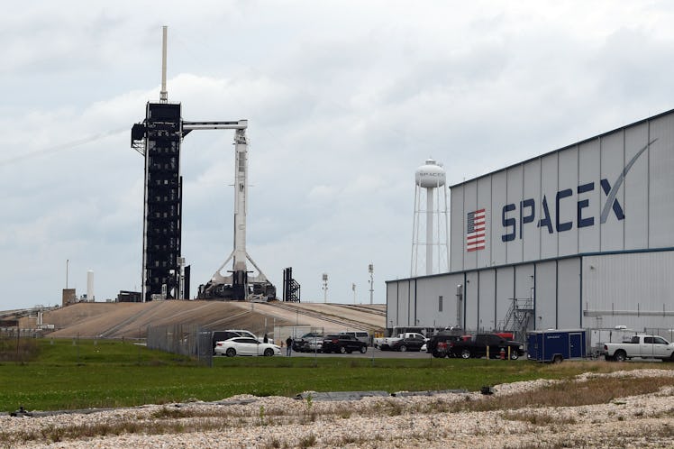 CAPE CANAVERAL, FL - APRIL 7: A SpaceX Dragon spacecraft sits atop a Falcon 9 rocket on launch Pad 3...