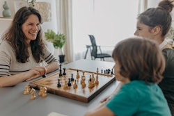 stepmother playing chess with stepkids, mother's day quotes for stepmomos