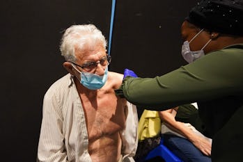 A woman gets 4th jab at a vaccination centre in Doncaster o   n 28 April 2022. (Photo by Giannis Alexop...