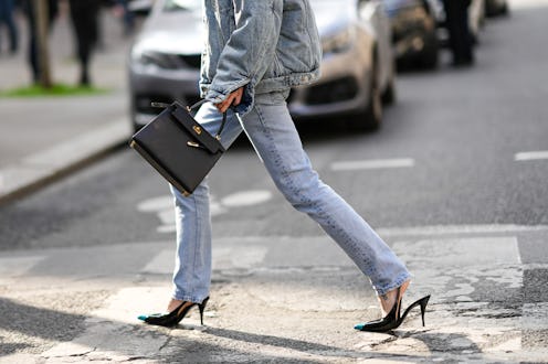 PARIS, FRANCE - MARCH 05: Pernille Teiba wears a blue faded oversized jacket, blue faded denim large...